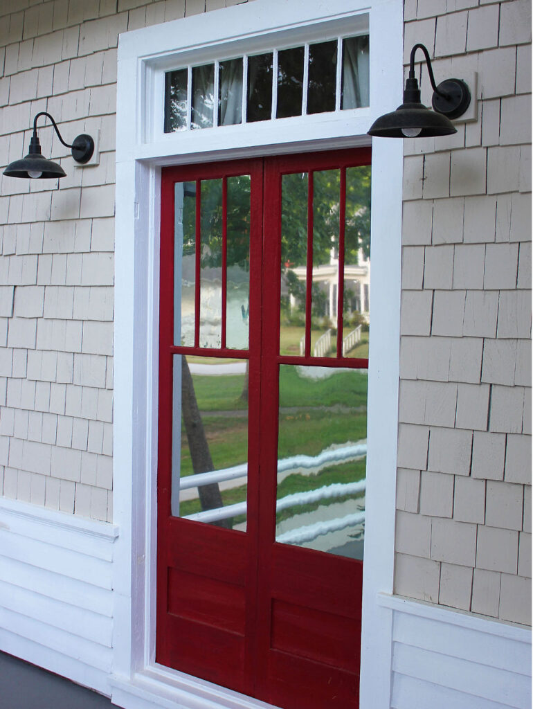 Vintage double red doors on patio.