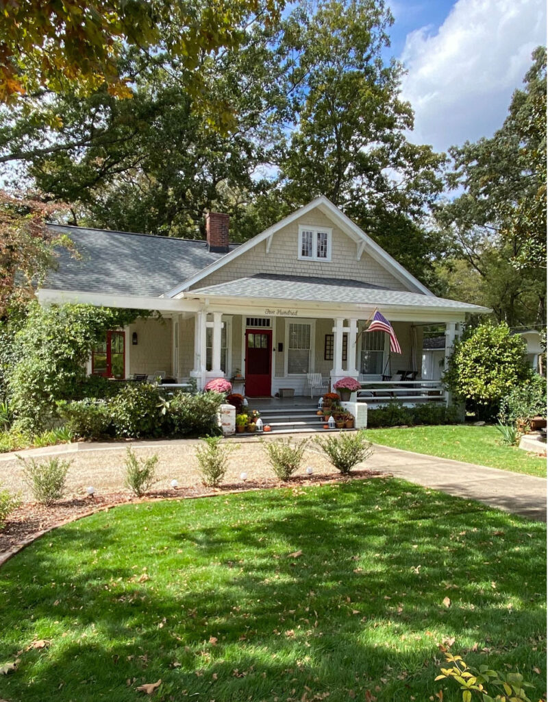 1914 Historic home with red front door and American flag.
