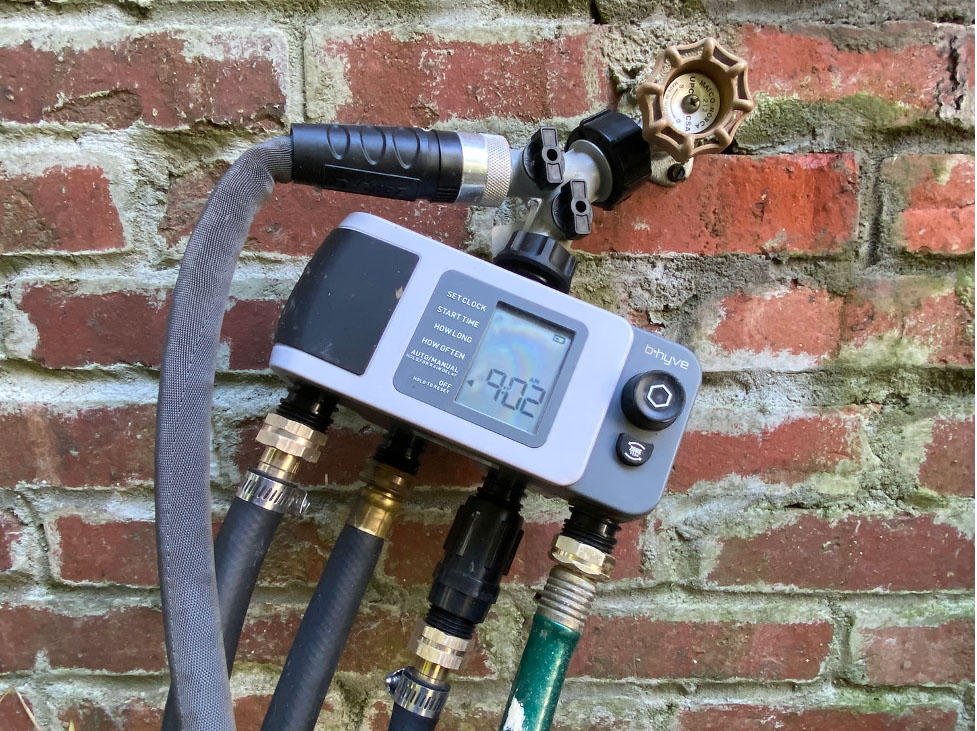 DIY Irrigation System Timer with hoses and connections.
