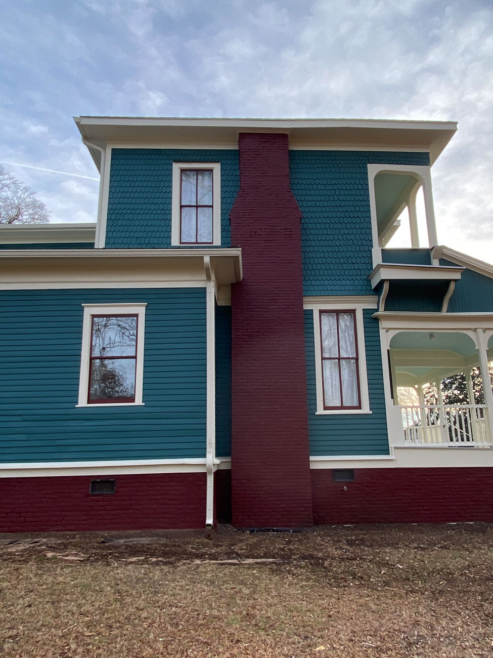 Gutters and Downspouts Match Trim Color on this Historic Home