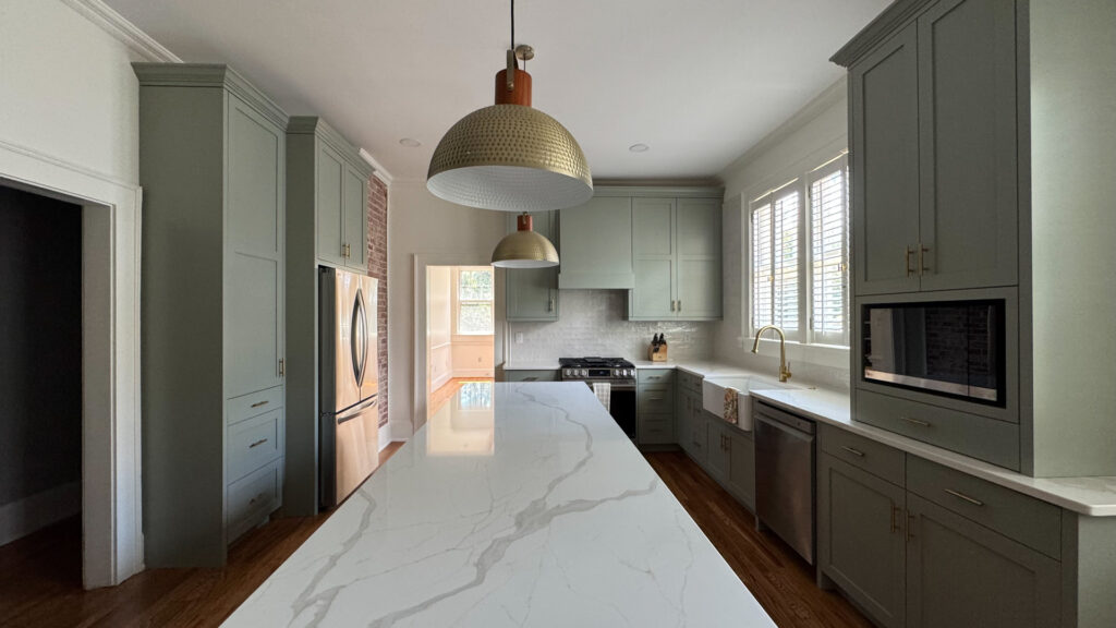 Quartz Countertops + Green Kitchen Cabinets