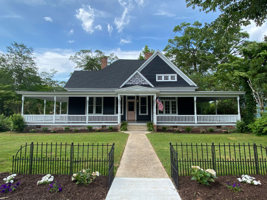 The Queen Anne - Black Exterior paint with Pink Door
